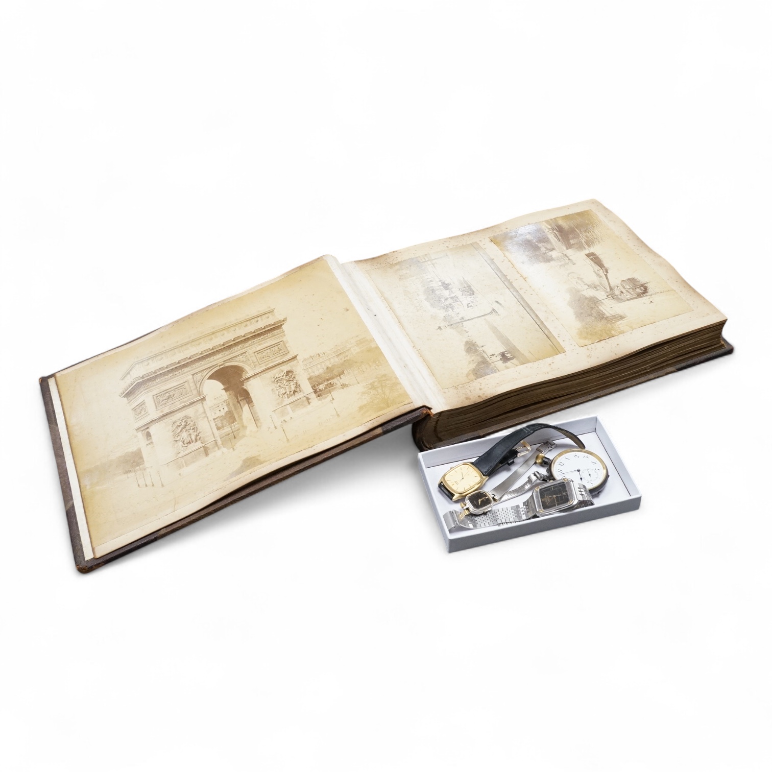 An early 20th century Photograph album of European views and a group of watches